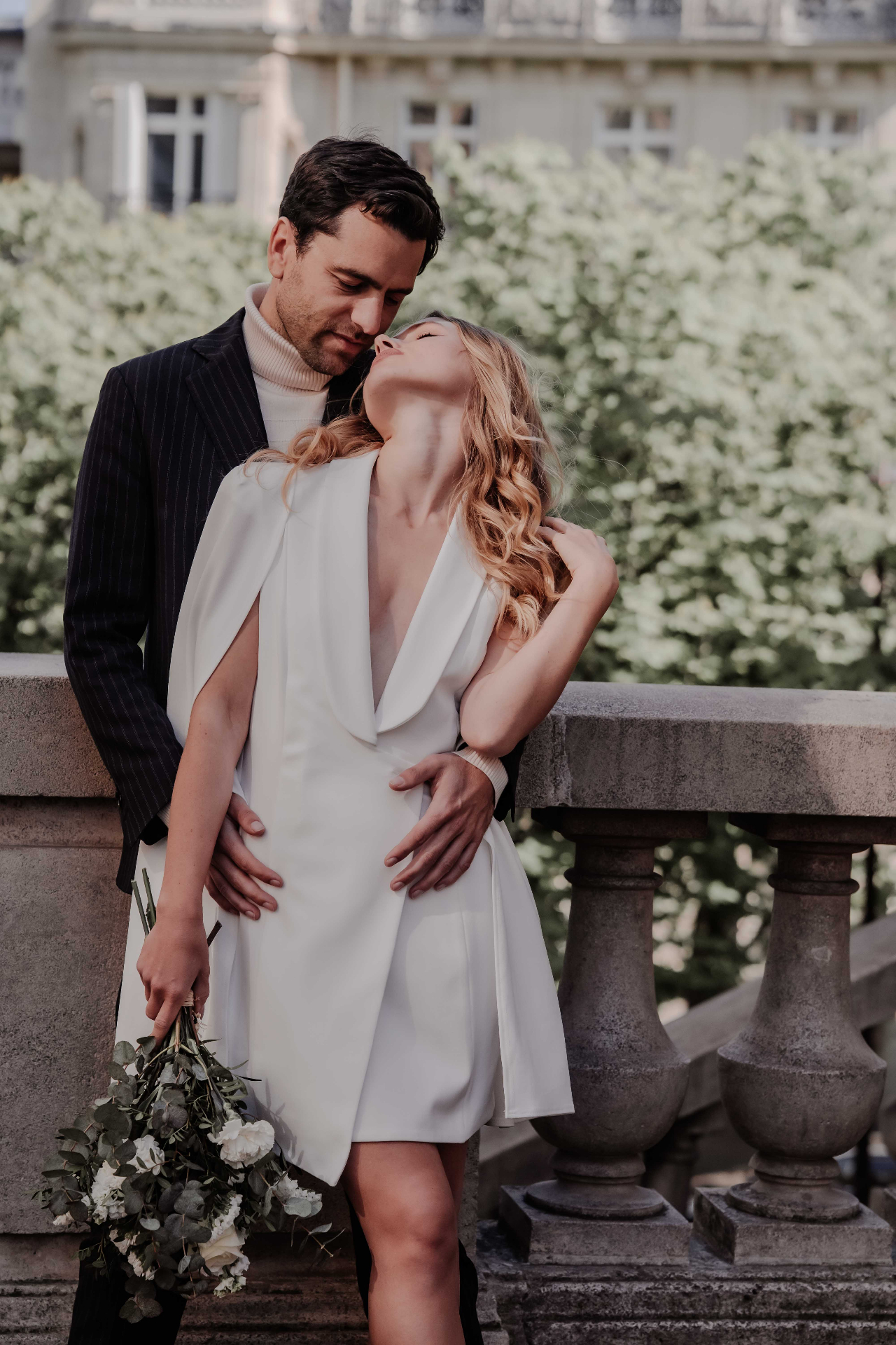 Editorial luxury wedding couple portrait on a sunlit stone terrace by Angela Johnson Photography