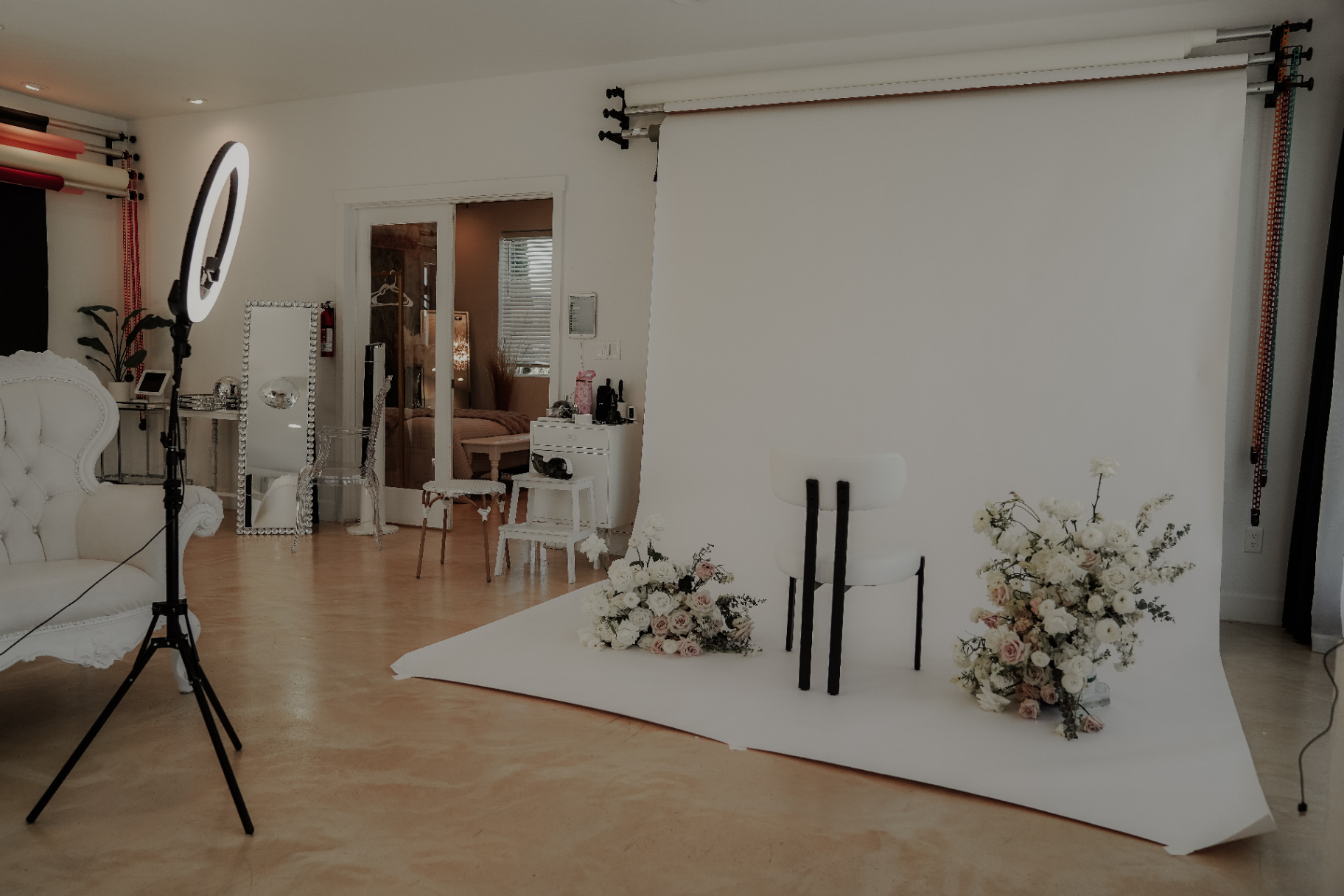 Glam Studios styled backdrop with florals