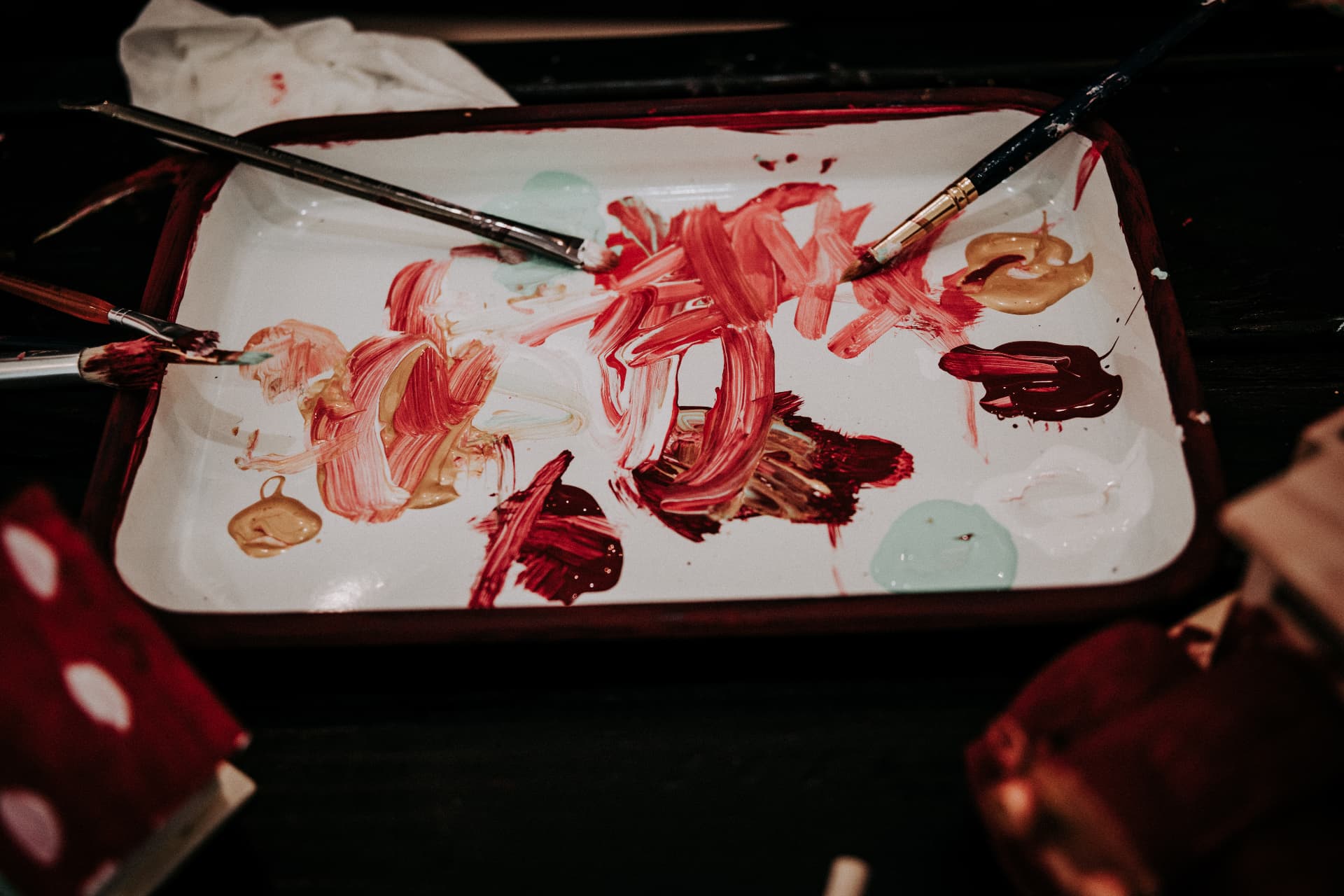 Paint tray and brushes used to hand-paint toys in the workshop