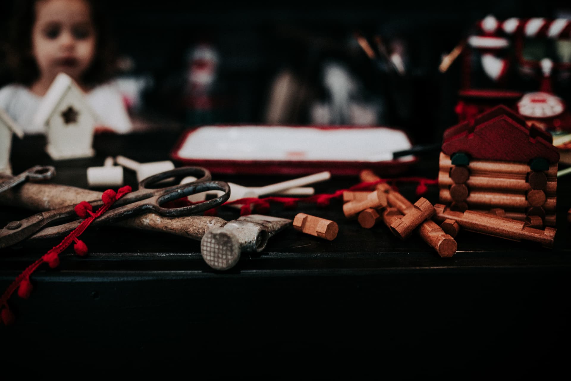 Hand tools and wooden toy logs on Santa's workbench