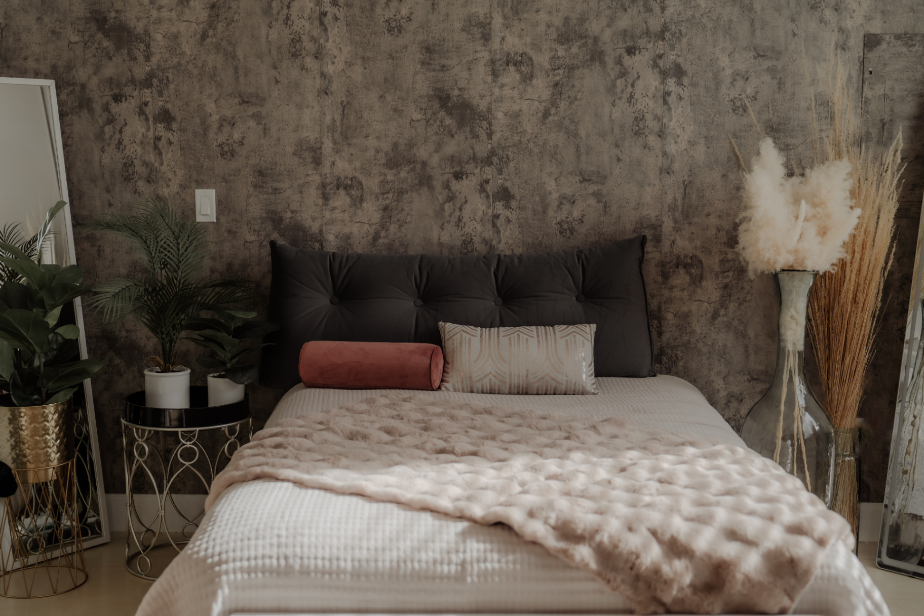 Boudoir suite with tufted headboard and textured wall
