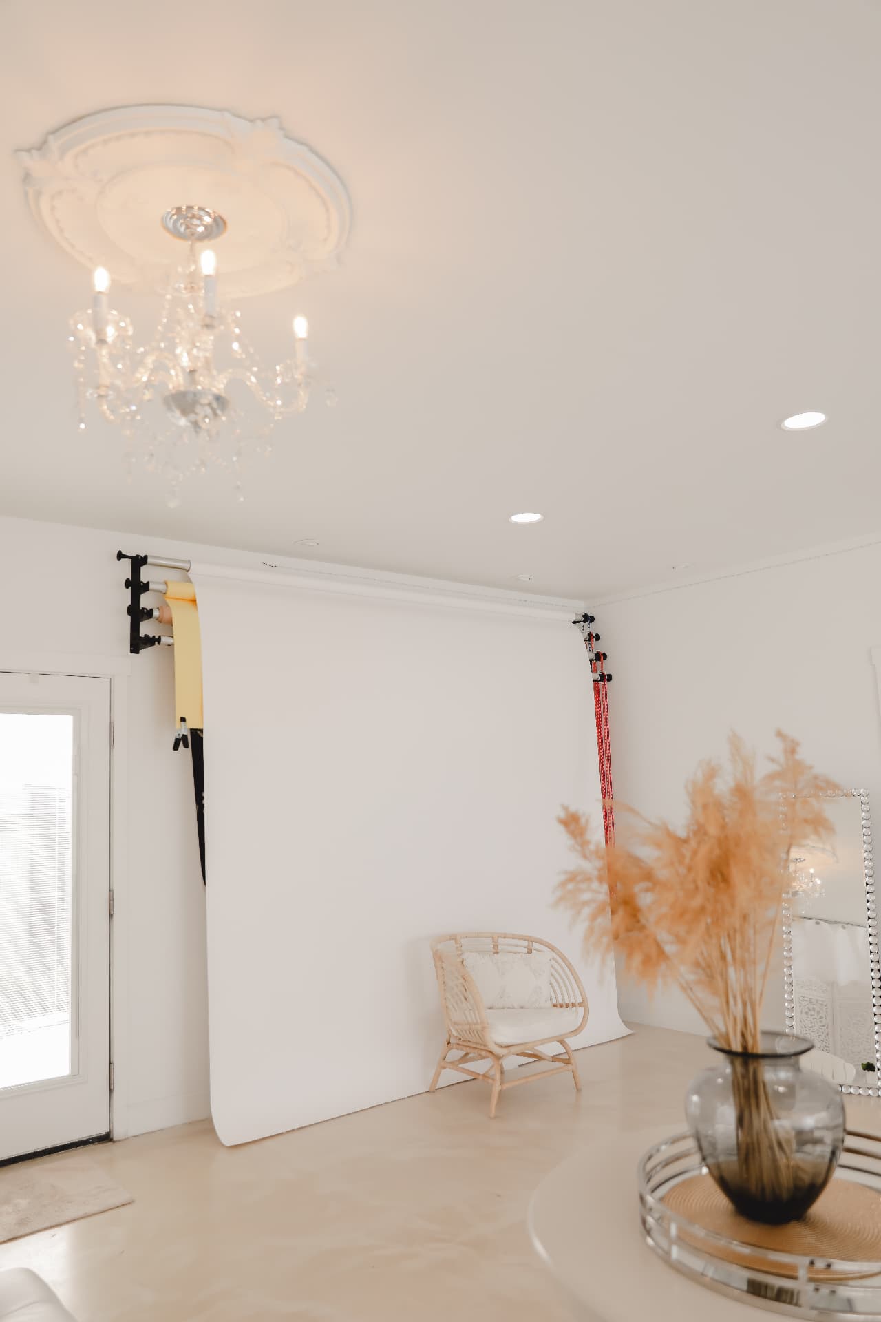 Seamless paper backdrops and crystal chandelier in the Glam Studios shoot bay